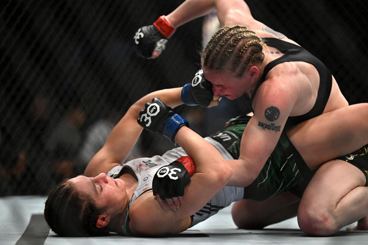 Kyrgyzstan's mixed martial arts fighter Valentina Shevchenko (R) fights Mexico's mixed martial arts fighter Alexa Grasso during their UFC 285 women's flyweight title bout at T-Mobile Arena, in Las Vegas, Nevada, on March 4, 2023. (Photo by Patrick T. Fallon / AFP) (Photo by PATRICK T. FALLON/AFP via Getty Images)