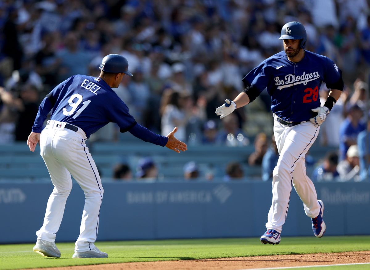 LOS ANGELES, CALIFORNIA - MAY 13: J.D. Martinez #28 of the Los Angeles Dodgers celebrates his solo homerun with Dino Ebel #91, to take a 3-1 lead over the San Diego Padres, during the first inning at Dodger Stadium on May 13, 2023 in Los Angeles, California. (Photo by Harry How/Getty Images)