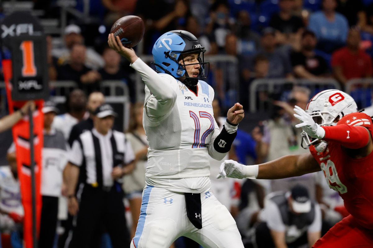 SAN ANTONIO, TX - MAY 13 : Luis Perez #12 of the Arlington Renegades looks to make a pass against DC Defenders during the first half of XFL Championship game at the Alamodome on May 13 2023 in San Antonio, Texas.  (Photo by Ronald Cortes/Getty Images)