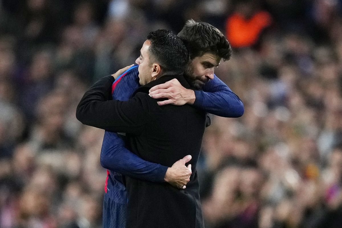 Gerard Piqué y Xavi Hernández.